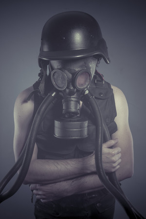 Smoke, Man with black gas mask, pollution concept and ecological disasterの写真素材