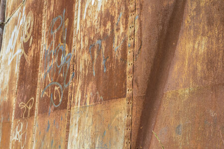 Grafitti, old abandoned train station, rusty iron wallsのeditorial素材