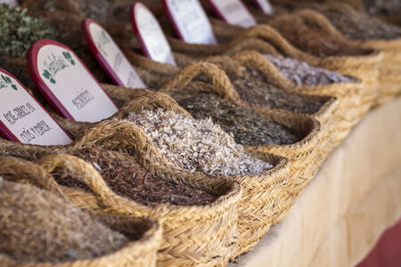 wicker baskets stuffed medicinal healing herbsの写真素材