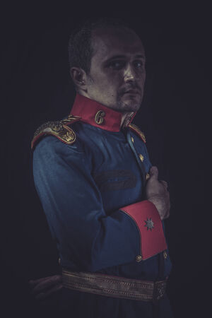 Retro, old soldier style jacket with blue and gold epaulettes, Spanish armyの写真素材