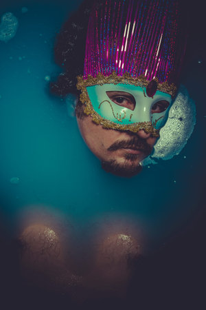 man immersed in bluewater, concept of depressionの写真素材