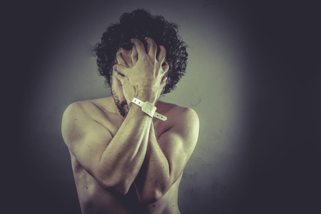 Concept help Man with hospital bracelet.の写真素材