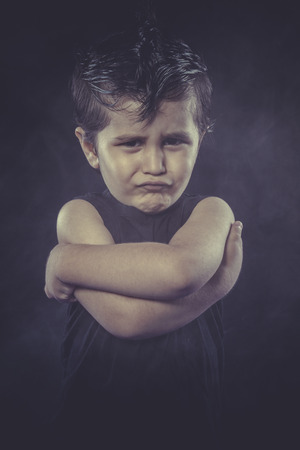 boy with slicked-back hair, funny and expressiveの写真素材