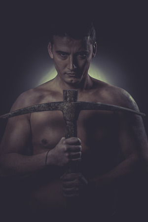 Construction worker portrait holding a peak.の写真素材