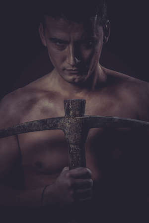 Vitality, Construction worker portrait holding a peak.の写真素材