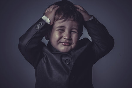 funny little business boy over grey の写真素材