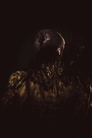 Steampunk, man beard and suit made with golden wingsの写真素材