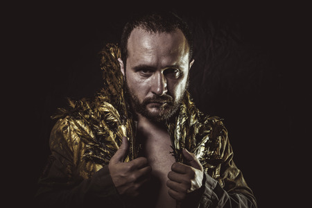 masculinity, man beard and suit made with golden wingsの写真素材