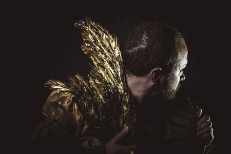 fantasy Steampunk, man beard and suit made with golden wingsの写真素材