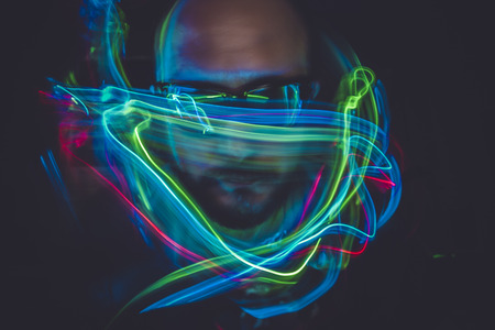 design effect lightpainting man with sunglasses and colored lightsの写真素材