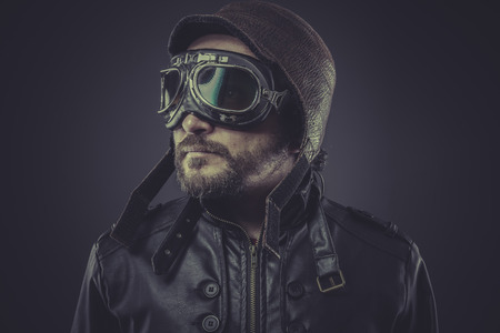 ww2 pilot dressed in vintage style leather cap and gogglesの写真素材