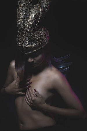 Latina with Golden Helmet and nakedの写真素材