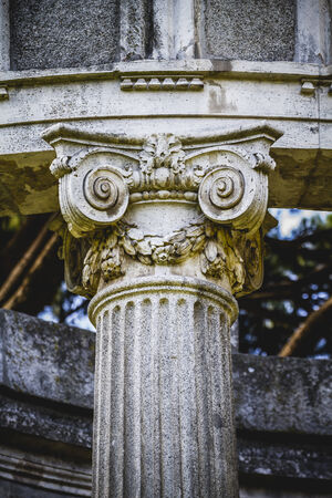 ancient, Greek-style columns, Corinthian capitals in a parkの写真素材