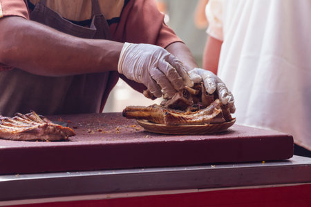 medieval cook, barbecue with sausages and pork sausages