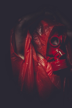 industrial nuclear concept, man with red gas maskの写真素材