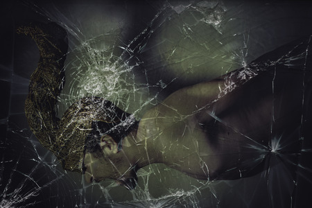 warrior man with golden helmet, broken glassの写真素材