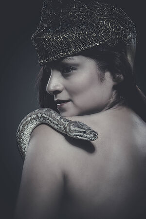 beautiful latin woman with python snakeの写真素材