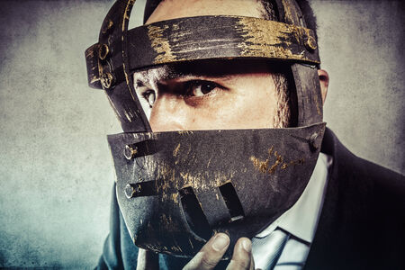 fury, dangerous business man with iron mask and expressionsの写真素材