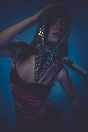 Model, Beautiful woman with evening make-up. Jewelry and Beauty. Fashion photo, helmet with mirrorsの写真素材
