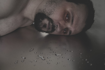 Man crying in the floorの写真素材