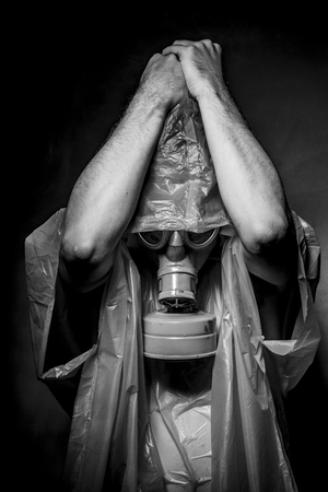 Ebola infection concept, man with red gas maskの写真素材