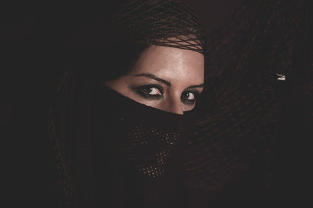 woman in traditional Islamic veil, burka, beautiful and deep lookの写真素材