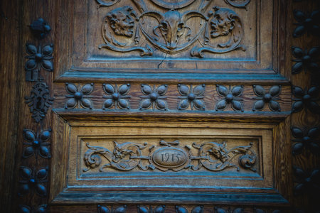 old wooden door with carvingsの写真素材