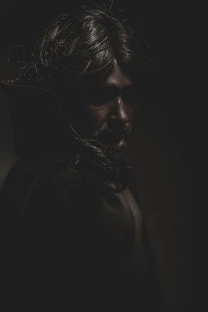 Vampire with red coat and long hair, nude