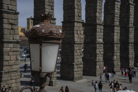 Tourist, Roman aqueduct of segovia. architectural monument declared patrimony of humanity and international interest by UNESCO. Spainの写真素材