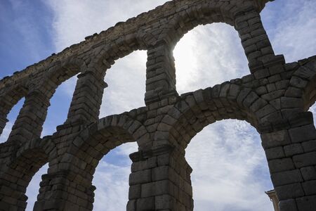 Tourist, Roman aqueduct of segovia. architectural monument declared patrimony of humanity and international interest by UNESCO. Spainの写真素材