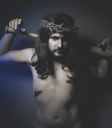 Jesus Christ with crown of thorns and baseball batの写真素材