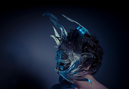 bearded man with silver mask Venetian style. Mystery and renaissanceの写真素材