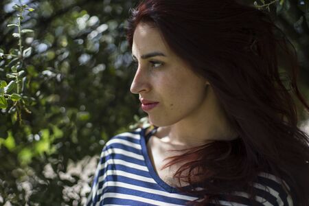Love, girl with straw hat in a park in springの写真素材