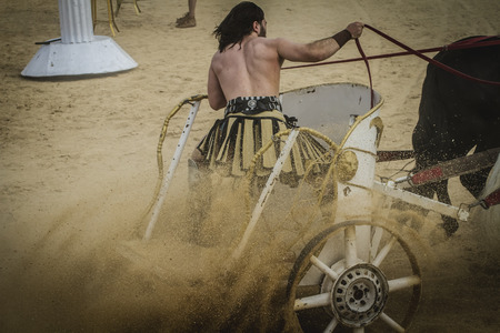 Strong, chariot race in a Roman circus, gladiators and slaves fightingの写真素材