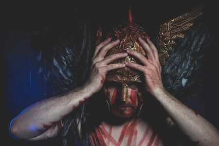 bearded man warrior with metal helmet and shield, wild Vikingの写真素材