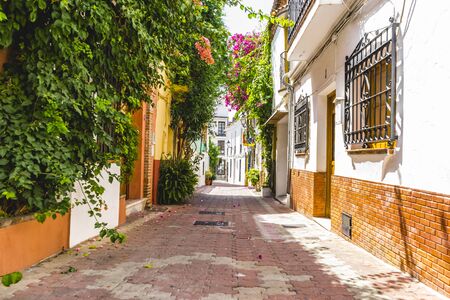 Vacation, streets of Marbella in Spain with flowers and plants on the facadeの写真素材