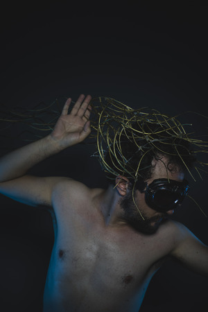 atomic, depression and anxiety, naked man with a crown of thorns on his headの写真素材