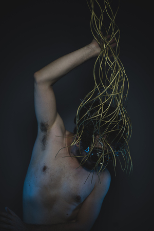 hostile, depression and anxiety, naked man with a crown of thorns on his headの写真素材