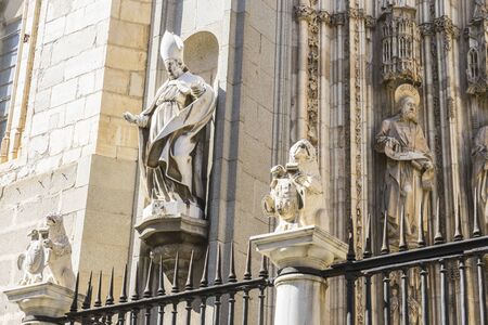 Iron fence, majestic facade of the cathedral of Toledo in Spain, beautiful churchの写真素材