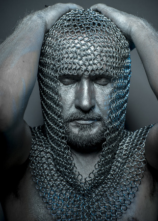 Performance, medieval executioner mesh iron rings on the headの写真素材