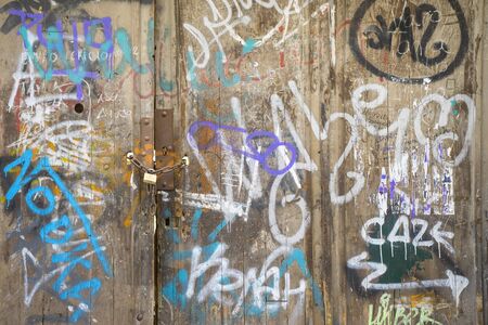 medieval door Spanish city of Segovia. Old metal entrance. ancient architecture, grafittiのeditorial素材