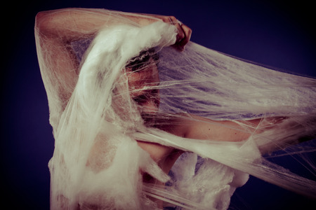 Connection, mental disorders, man trapped in a giant spider webの写真素材