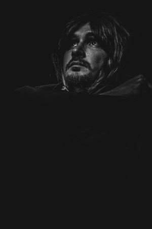 Mystery, vampire man with great contrasts of light, large black cloakの写真素材