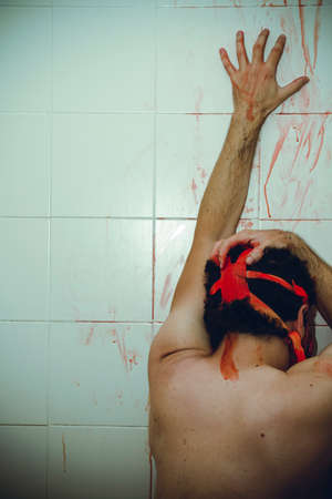 nuclear naked man with red gas mask, blood, despair and suicideの写真素材