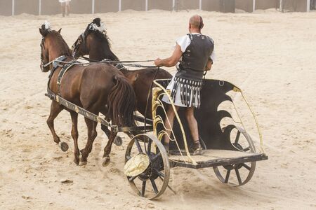 Leader, Roman chariots in the circus arena, fighting warriors and horsesの写真素材