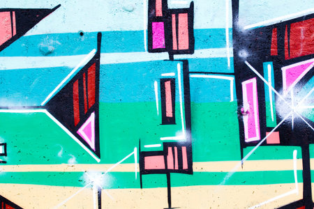 typography and color lines, segment of an urban grafitti on wallの写真素材