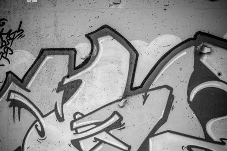 segment of a street art grafitti in black and white ink