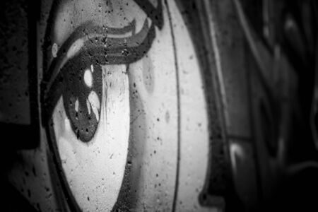 black ink grafitti design in city wall, street art segmentの写真素材