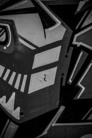 street art grafitti in black and white ink, segment of a dirty wall in the cityの写真素材
