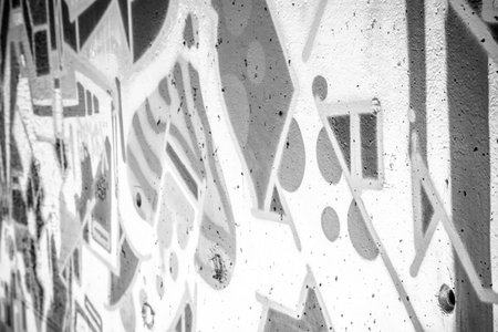 a city wall with graffiti in black and white, urban art